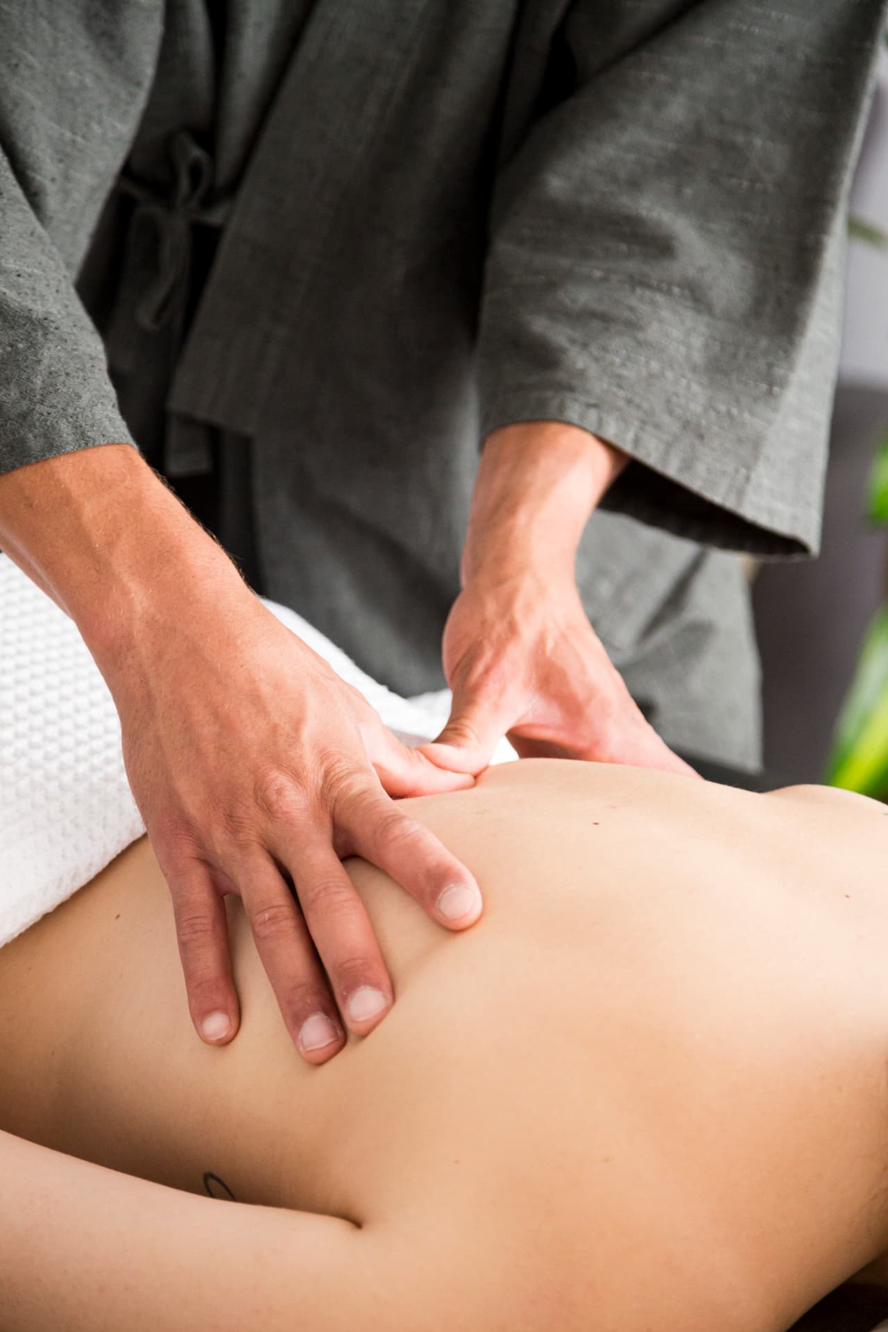 Shiatsu pressure applied with the thumbs during a session